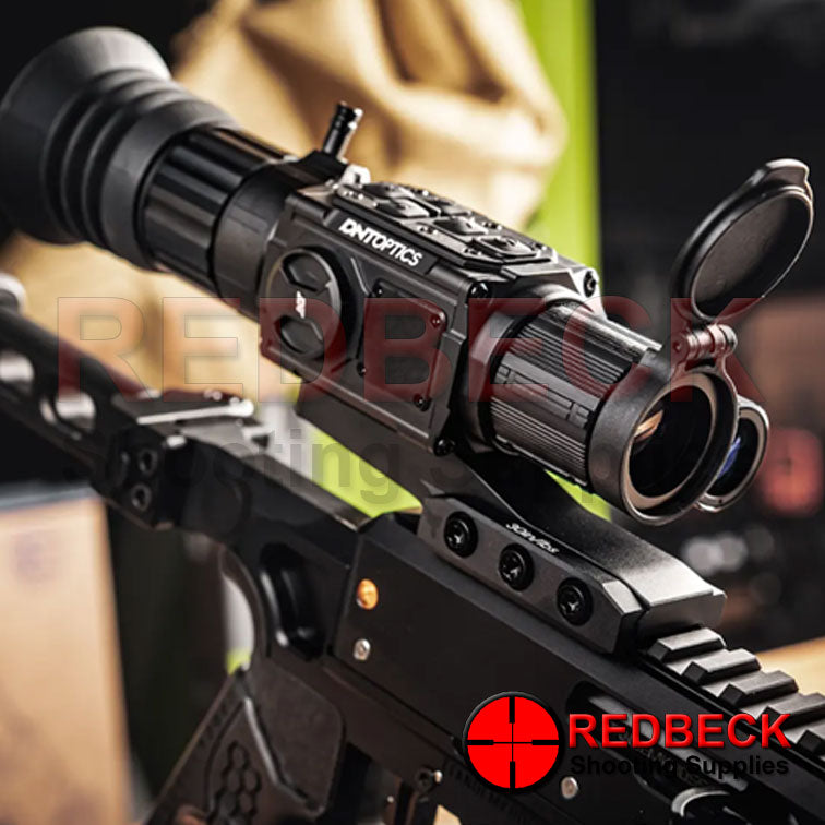 DNT OPTICS ZULUS V2 HD 5-20X WITH LRF LIFESTYLE VIEW Showing The Scope Attached With Flip Up Covers On Display.