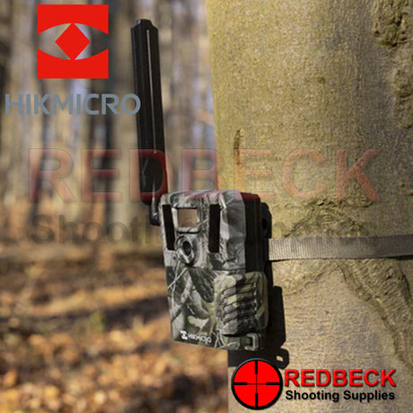HIK Micro M15 4G Trail Camera shown attached to a tree in the woods.