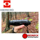 HIK MICRO LYNX LH19 19MM PRO THERMAL MONOCULAR. Shown in shooters hand in the field from the right hand side.