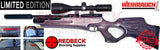 WEIHRAUCH HW100 KT LIMITED EDITON WITH GREY LAMINATE STOCK AND BLACK BARREL SHOWN FROM LEFT HAND SIDE WITH A SCOPE ATTACHED. THE AIR RIFLE COMES WITH LIMITED EDITION GREY WEIHRAUCH BAG AND CERTIFICATE.