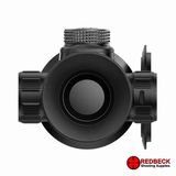 A black RedBeck optical sight or scope photographed from the front on a plain white background, with a RedBeck Shooting Supplies logo in the bottom right corner.