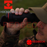 HIK Micro Falcon FH35 Monocular showing in use in field by shooter.