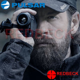 Pulsar Axion XM30F Hand Held Thermal Imaging Monocular being looked through by shooter.